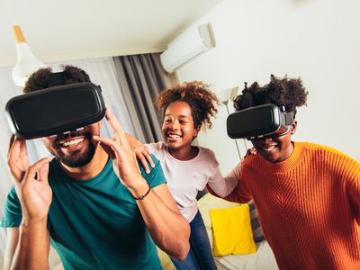 A family using VR headset in their living room.