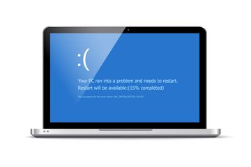 A Blue Screen of Death on a laptop screen.