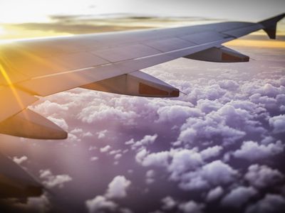 Airplane wing above clouds