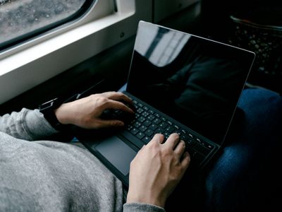 A man with a black screen on his Windows 11 Microsoft Surface Pro laptop.