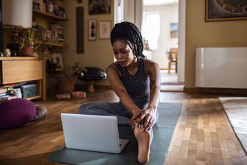 A woman in front of a laptop.